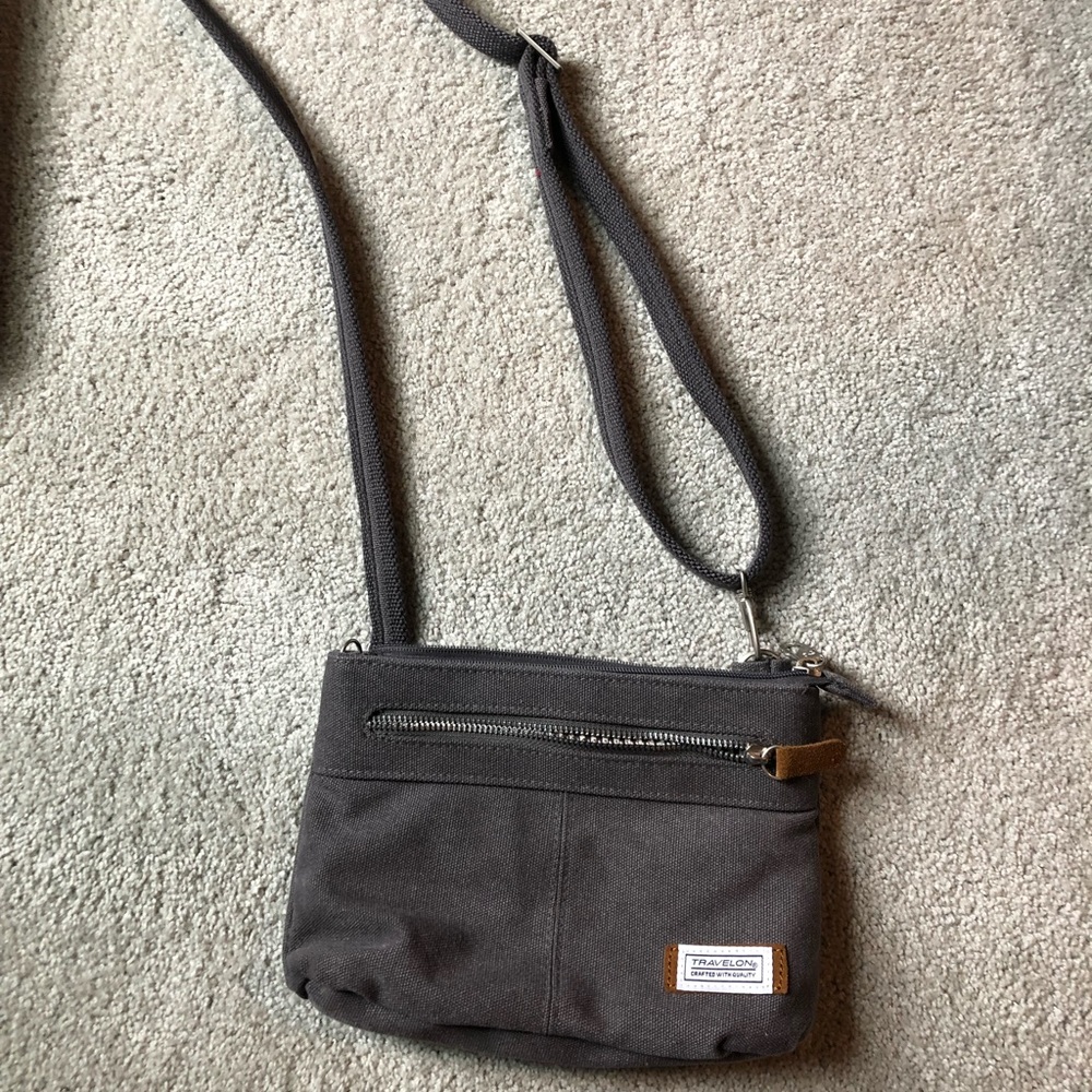 Never used cross body Travelon lockable purse